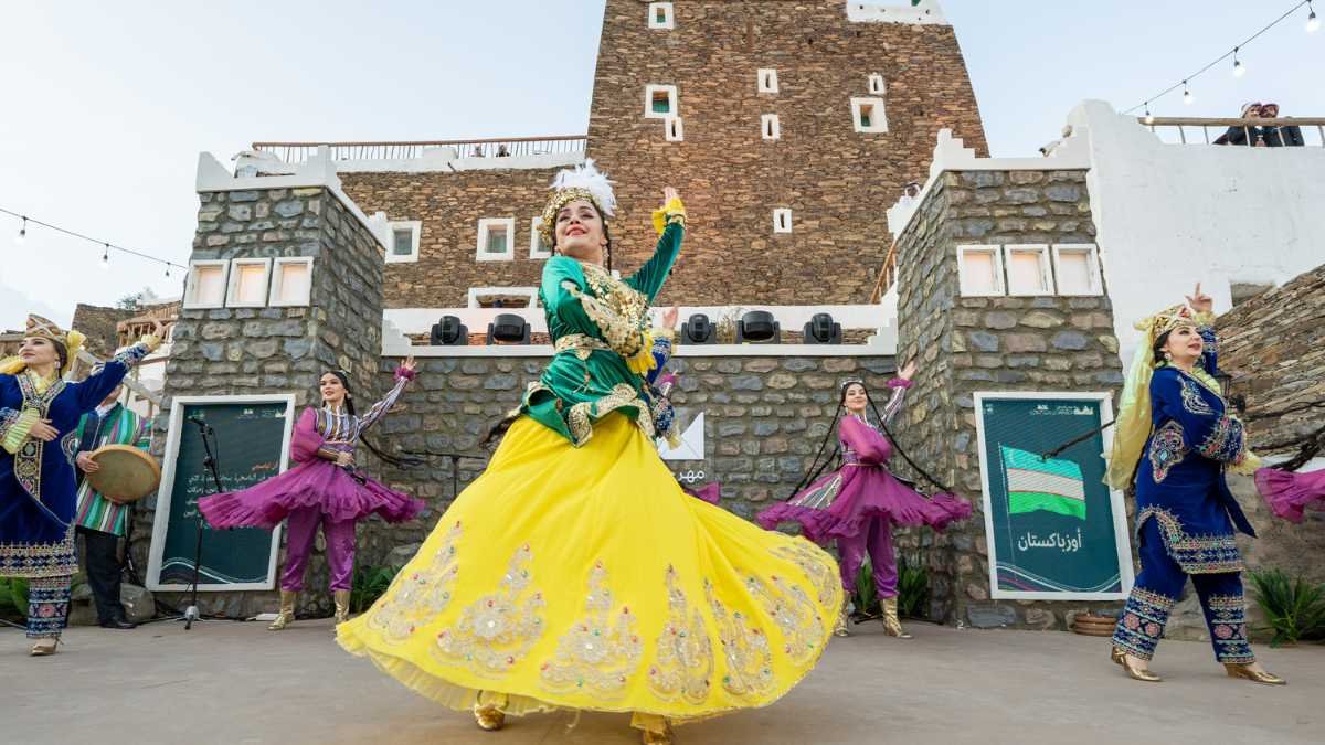 Explore the enchanting world of mountain performance arts at the Qemam International Festival in Saudi Arabia's Asir region.