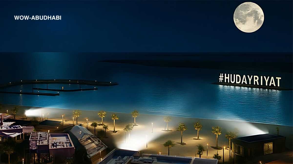 Night beach at Abu Dhabi Corniche with lights and lifeguards