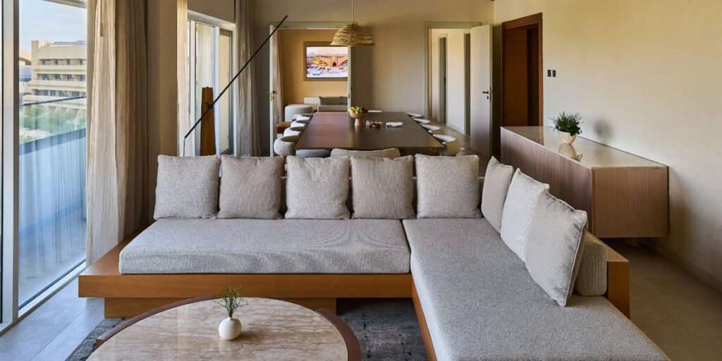 Spacious executive suite with living room and dining area at Erth Abu Dhabi